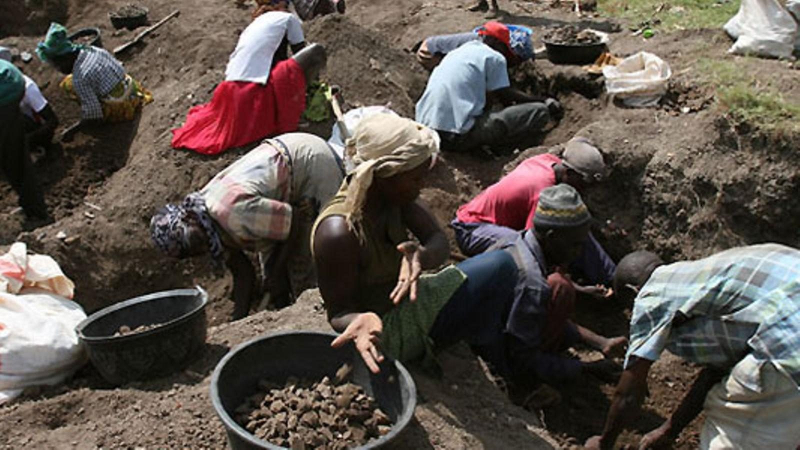 Miners sorting and processing gold-bearing ore in the Migori belt